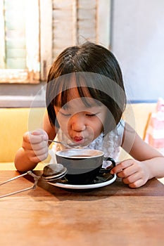 Asian Little Chinese Girl drinking hot tea