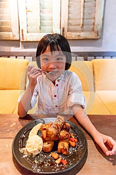 Asian Little Chinese Girl eating breakfast