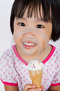 Asian Little Chinese Girl Eating Ice Cream