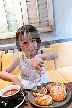 Asian Little Chinese Girl eating pancake