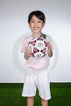 Asian Little Chinese Girl holding football