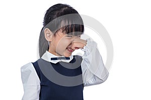 Asian Little Chinese Girl holding her nose