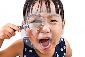 Asian Little Chinese Girl Holding Magnifying Glass