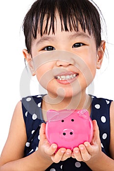 Asian Little Chinese Girl Holding Piggy Bank