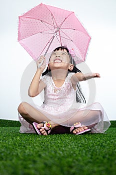 Asian Little Chinese Girl holding umbrella