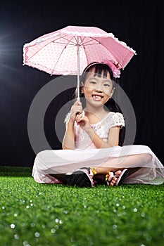 Asian Little Chinese Girl holding umbrella