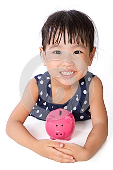 Asian Little Chinese Girl Hugging Piggy Bank
