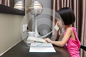 Asian Little Chinese Girl making calls