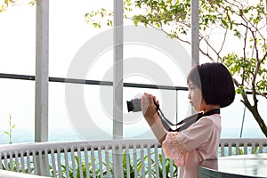 Asian Little Chinese Girl playing with camera