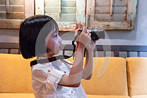 Asian Little Chinese Girl playing camera