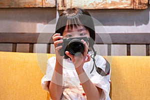 Asian Little Chinese Girl playing camera