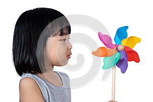 Asian Little Chinese Girl Playing Colorful Pinwheel