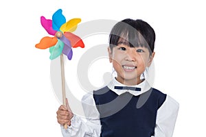 Asian Little Chinese Girl Playing Colorful Pinwheel