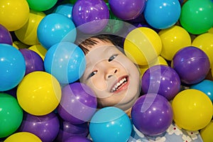 Asian Little Chinese Girl Playing with Colorful Plastic Balls