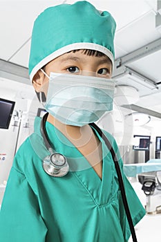 Asian Little Chinese Girl Playing a Doctor with Mask and Stethos