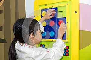 Asian Little Chinese Girl playing puzzle