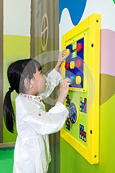 Asian Little Chinese Girl playing puzzle