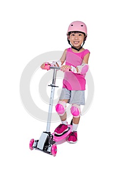 Asian little Chinese girl playing with scooter