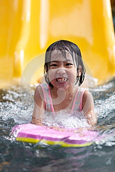 Asian Little Chinese Girl playing at water park