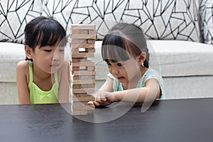 Asian Little Chinese Girl Playing Wooden stacks
