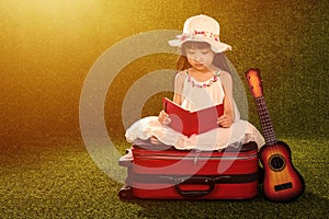 Asian Little Chinese girl reading book