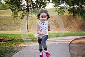 Asian Little Chinese Girl running happily