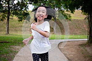 Asian Little Chinese Girl running happily