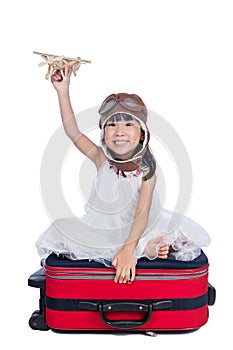 Asian Little Chinese girl sitting on floor and reading book