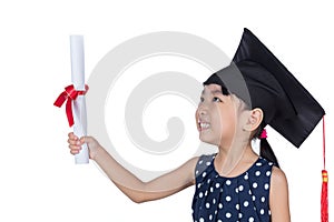 Asian Little Chinese girl sitting on floor and reading book