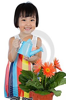 Asian Little Chinese Girl Watering Flower