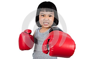 Asian Little Chinese Girl Wearing Boxing Glove With Fierce Expre