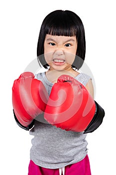 Asian Little Chinese Girl Wearing Boxing Glove With Fierce Expre