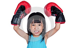 Asian Little Chinese Girl Wearing Boxing Glove With Fierce Expression