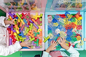 Asian Little Chinese Girls playing puzzle