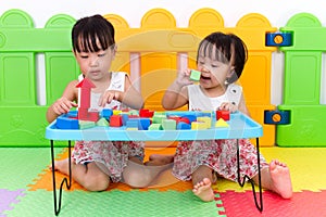 Asian Little Chinese Girls Playing Wooden Blocks