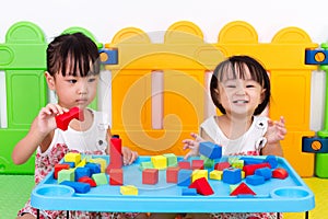 Asian Little Chinese Girls Playing Wooden Blocks