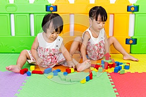 Asian Little Chinese Girls Playing Wooden Blocks