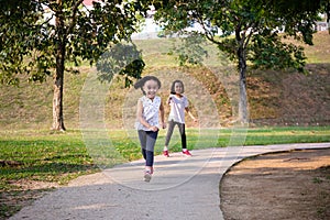 Asian Little Chinese Sisters running happily