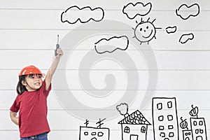 Asian Little girl engineering with creative drawing environment with happy family