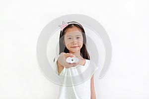 Asian little girl kid holding remote control isolated on white background