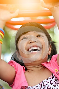 Asian little girl playing at playground