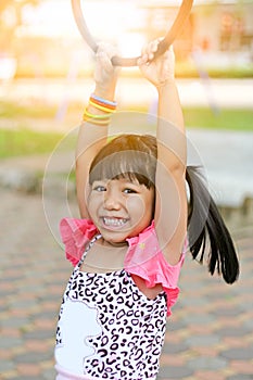 Asian little girl playing at playground