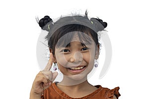 Asian little girl pointing his hand up making idea gesture at something and smile isolated on white background.