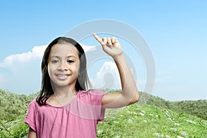 Asian little girl raised hands with a blue sky background