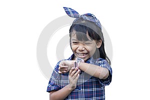 Asian little girl wearing a smart watch on her wrist and is calling cheerfully with friends on white background.