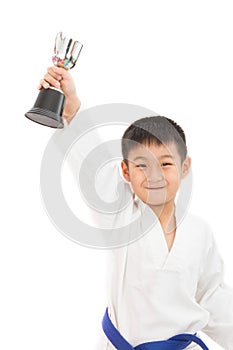 Asian Little Karate Boy Holding Cup in White Kimono
