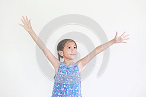 Asian little kid girl with pigtail hair standing and open wide arms with looking up isolated on white background