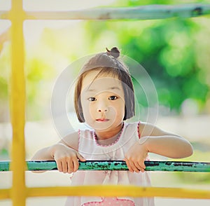 Asian little kid playing in the amusement park