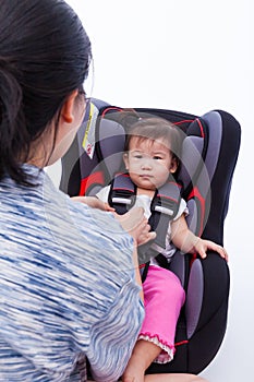 Asian lovely girl at car-seat and fasten seat belt