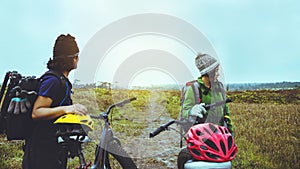 Asian lover woman and man Travel Nature. Travel relax ride a bike Wilderness in the wild. Thailand
